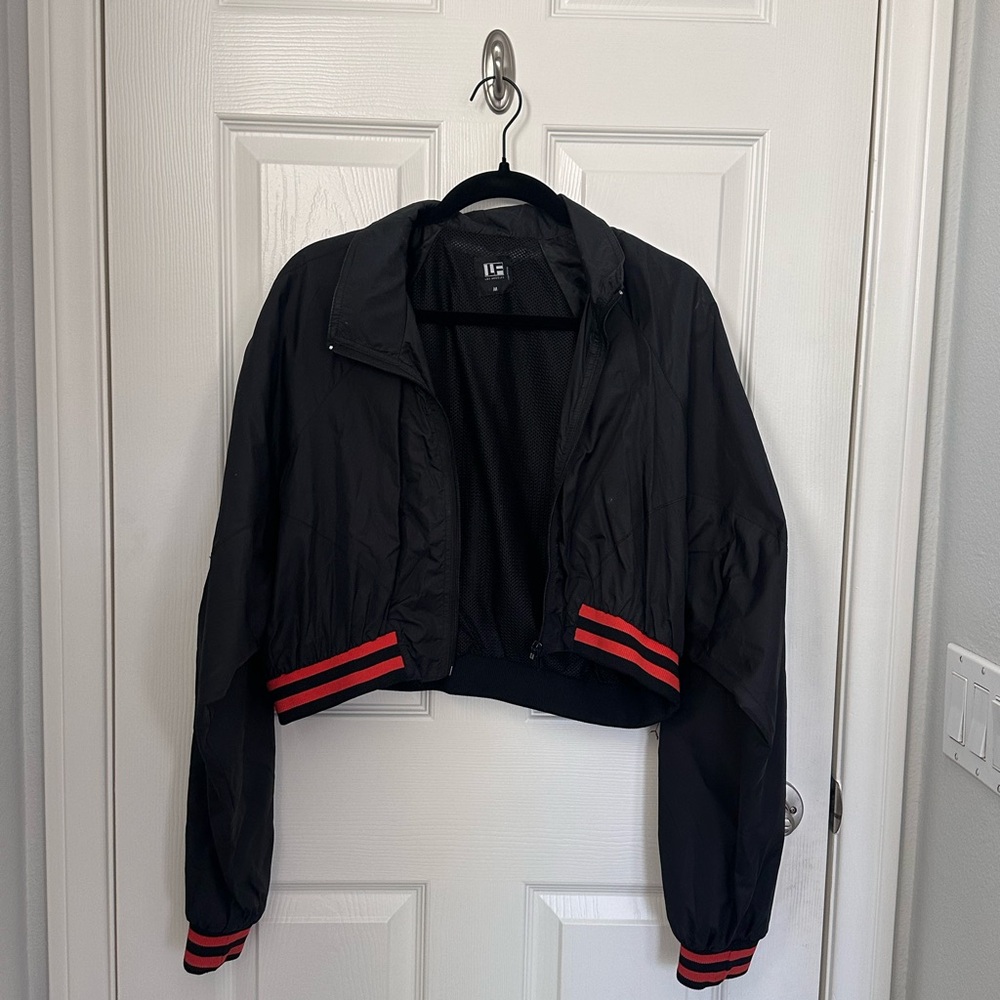 Black LF cropped windbreaker jacket with red/orange details